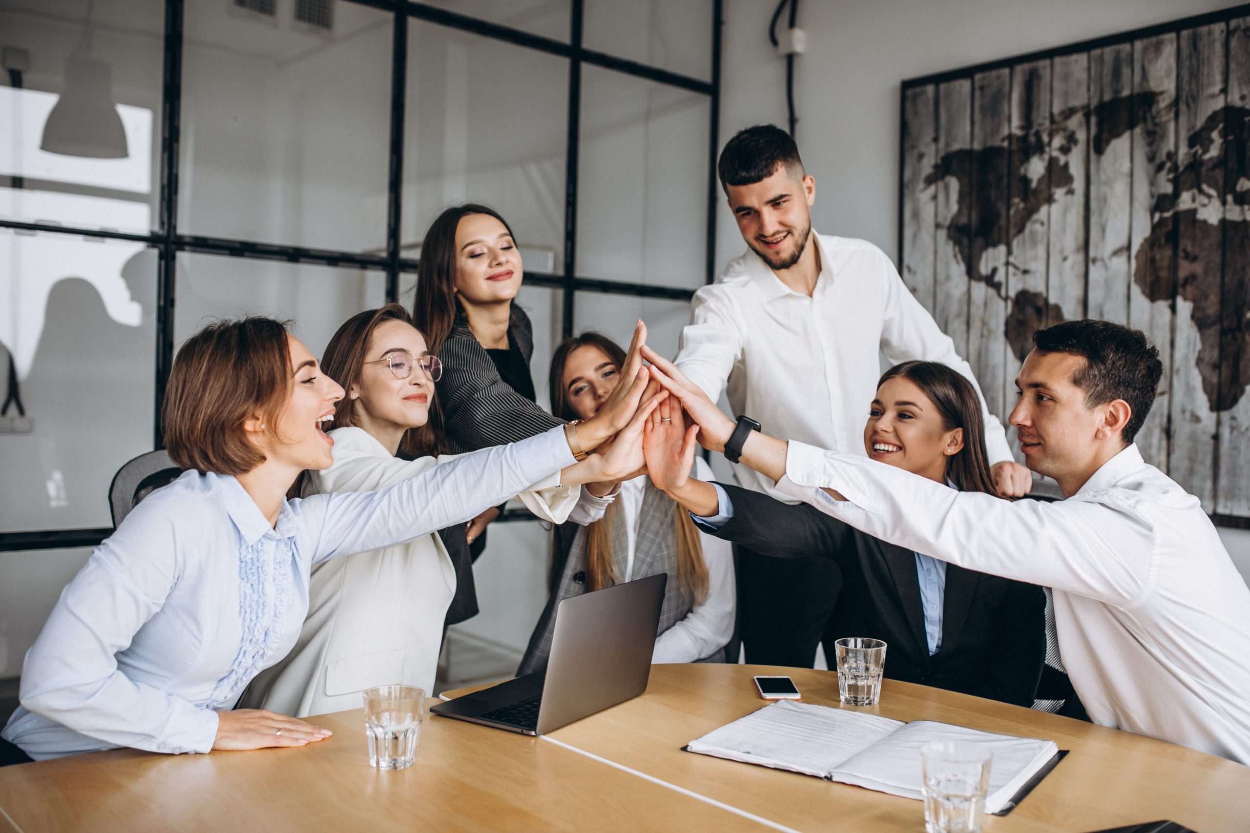 group of people working out business plan in an office scaled